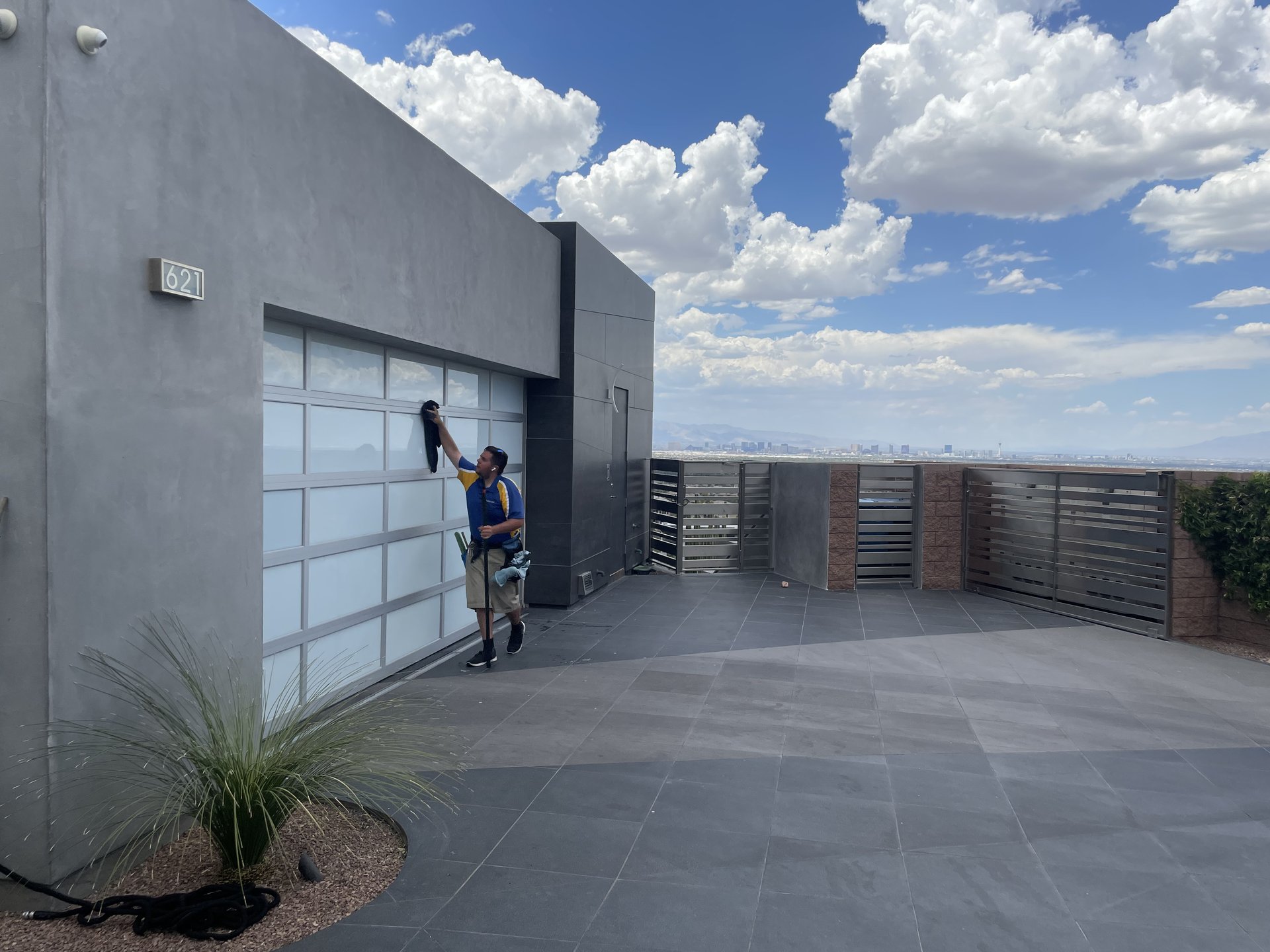 Residential window cleaning on modern home