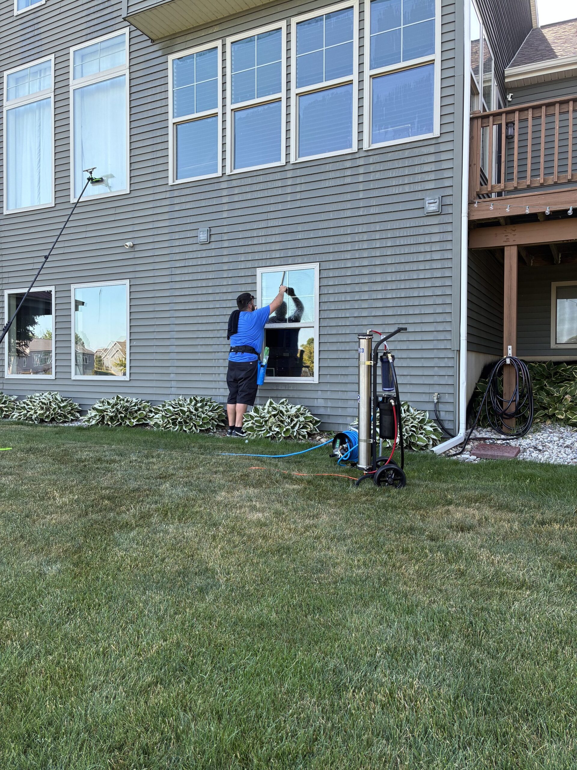Professional window cleaning equipment and crew in Spring Lake Michigan